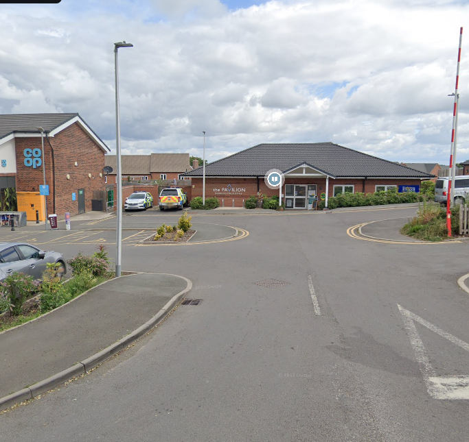 The view of the Pavilion Community Centre and Library from the road as you enter. The Co-op is on your left.